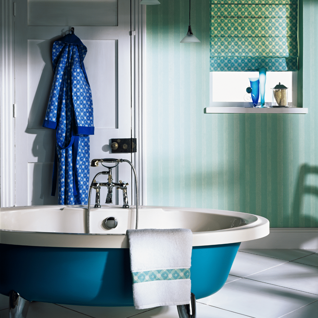 blue tub in a green and white bathroom